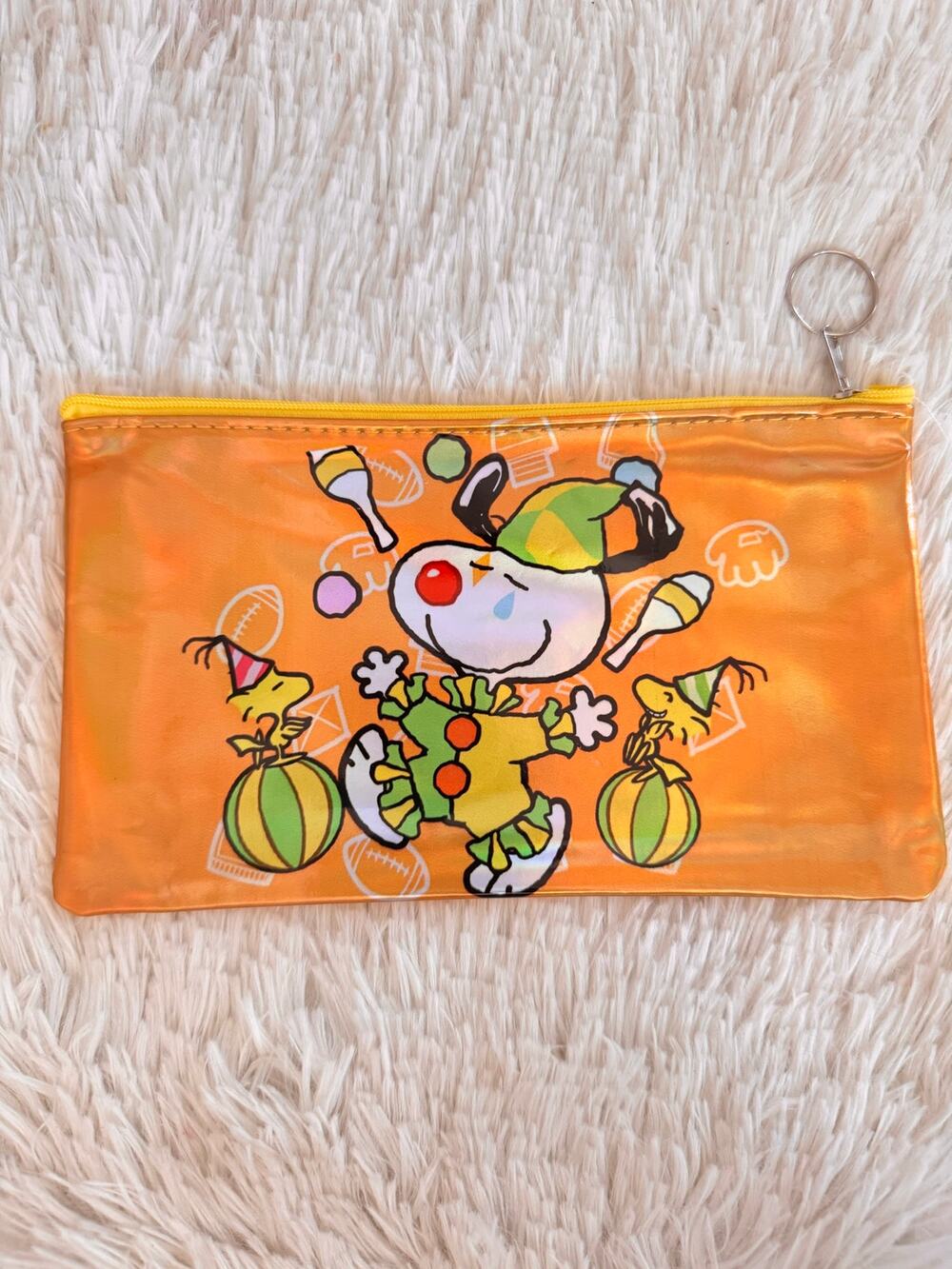 Snoopy and Woodstock pencil case with clown holding maracas and wearing a hat